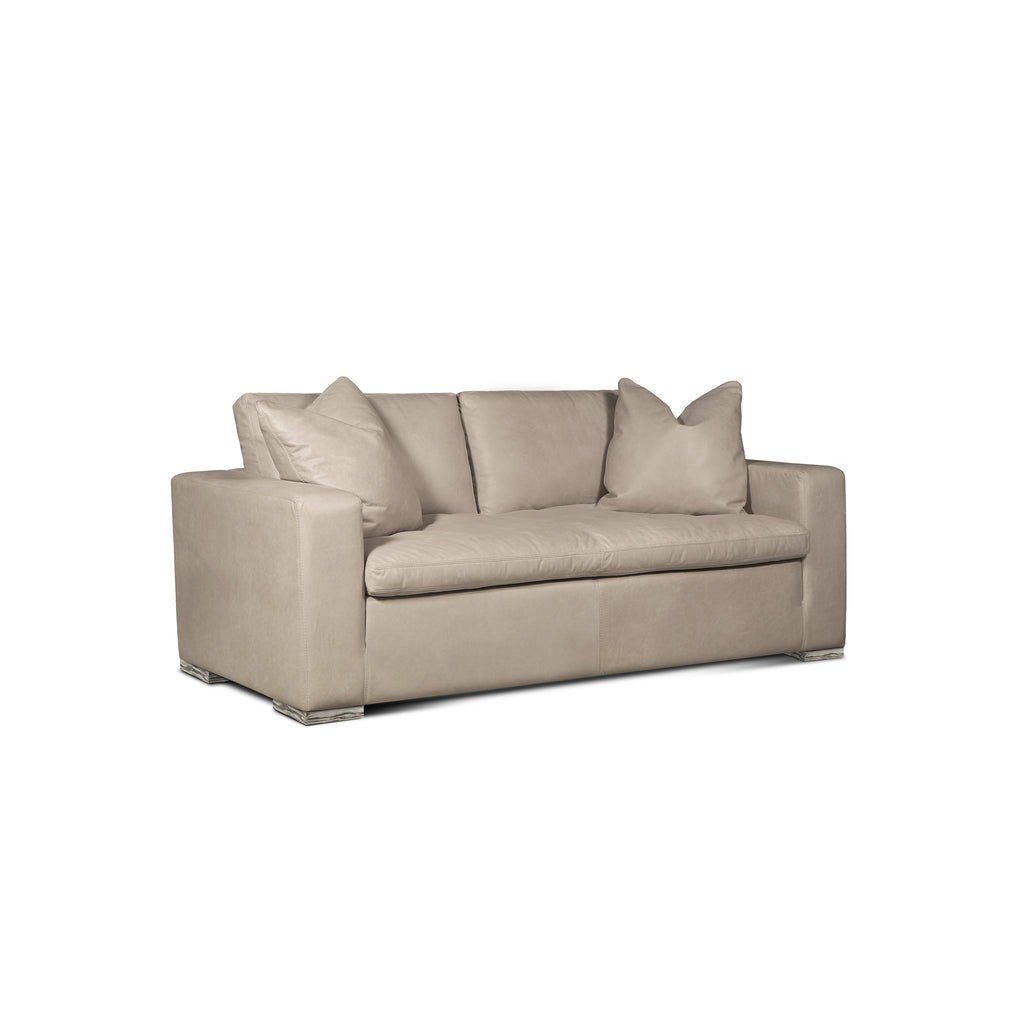 angled view of the Hand & Grain Aksel Loveseat