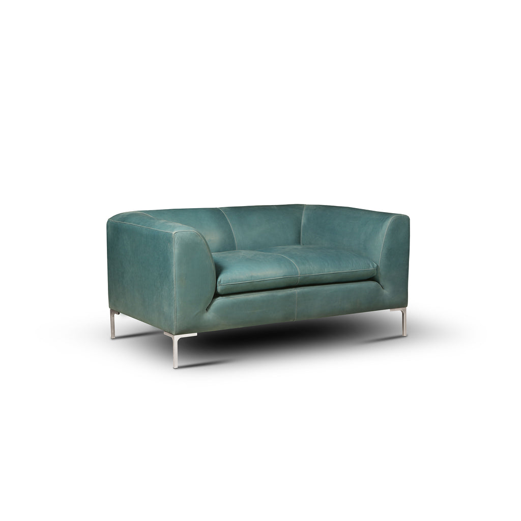 angled view of the Hand & Grain Pia Chair and a Half